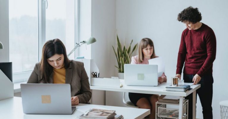 Standing Desks - People Working Together at the Office