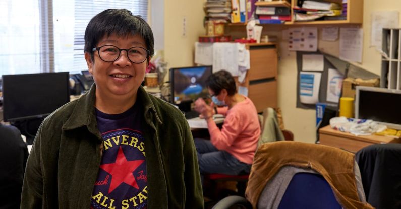 Refurbished Computers - Man in Black Framed Eyeglasses and Green and Red Pullover Hoodie