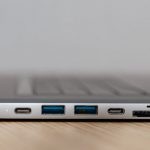 USB Hubs - Space grey type c USB hub with multiple different ports connected to laptop
