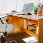 Business - White Rolling Armchair Beside Table