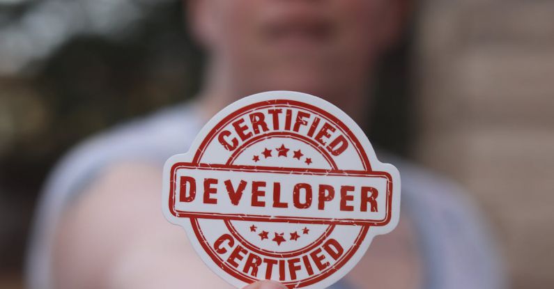 Certified - Finger Holding Badge
