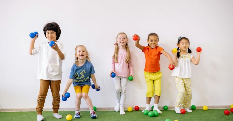 Latest Games - Little Girls and Boys Having Fun Playing With Colorful Balls